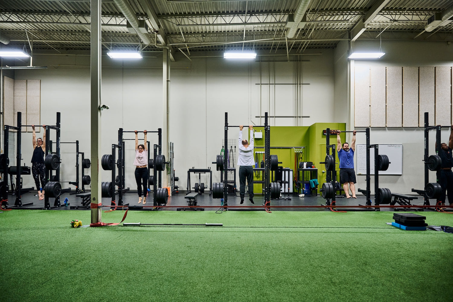 Group fitness members hanging at a Group Fitness Class at Human 2.0 Ottawa Physiotherapy, Massage, & Gym South Keys Location